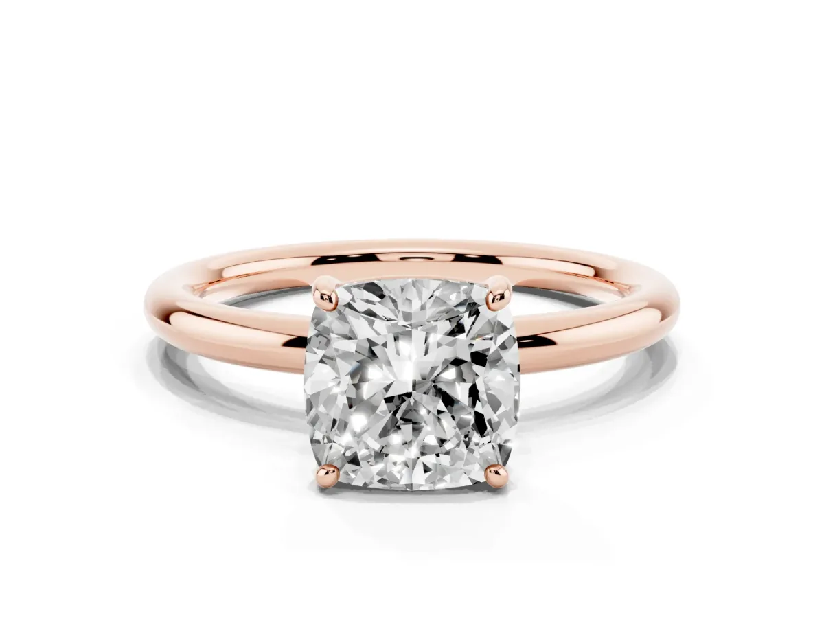 Cushion Cut Solitaire Diamond Ring with Four-Prong Setting on a Plain Band Rose gold