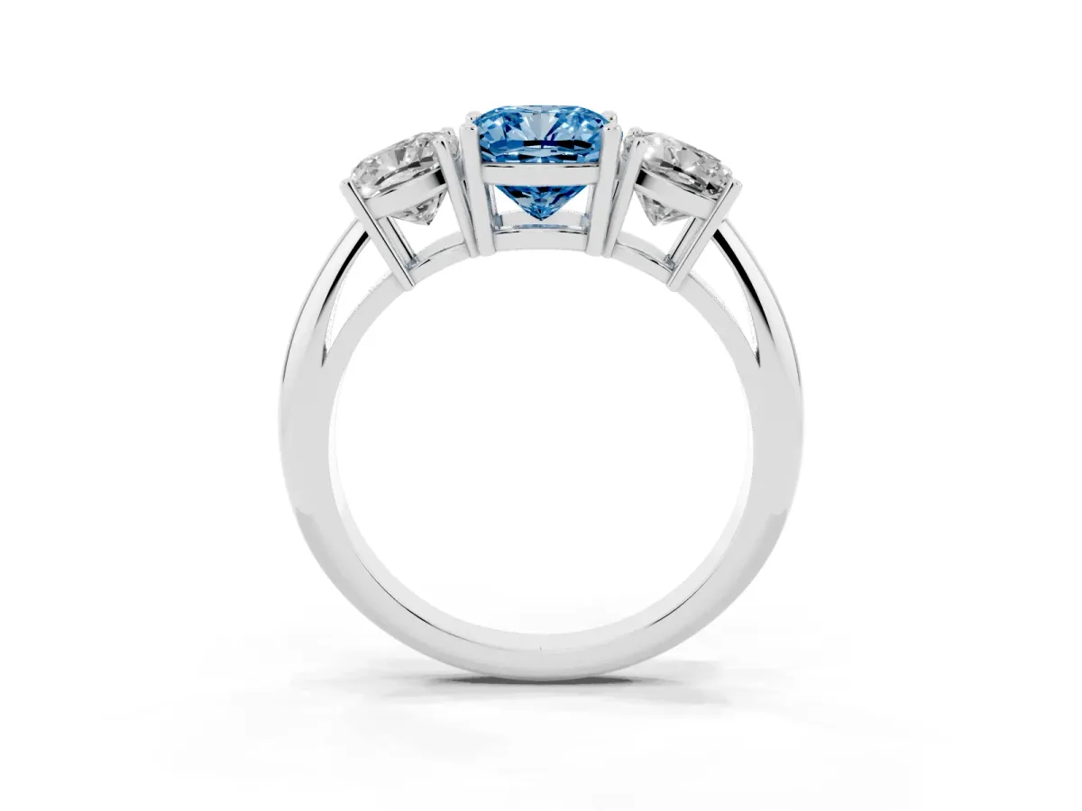 Fancy Blue Three-Stone Cushion Cut Cut Diamond Engagement Ring with Prong Setting on a White Gold Band Platinum
