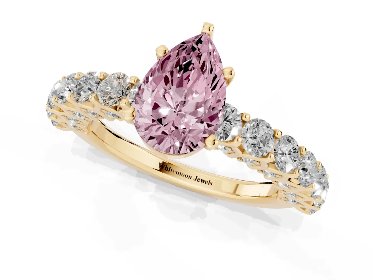 Fancy Pink Pear Cut Diamond Solitaire Ring with Shared Prong Pavé Band and Four-Prong Setting Yellow gold