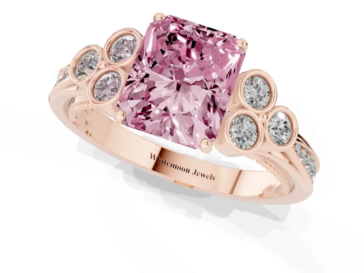 Fancy Pink Radiant Cut Cut Diamond Engagement Ring with Bezel Set Round Side Stones and Prong Setting Rose gold
