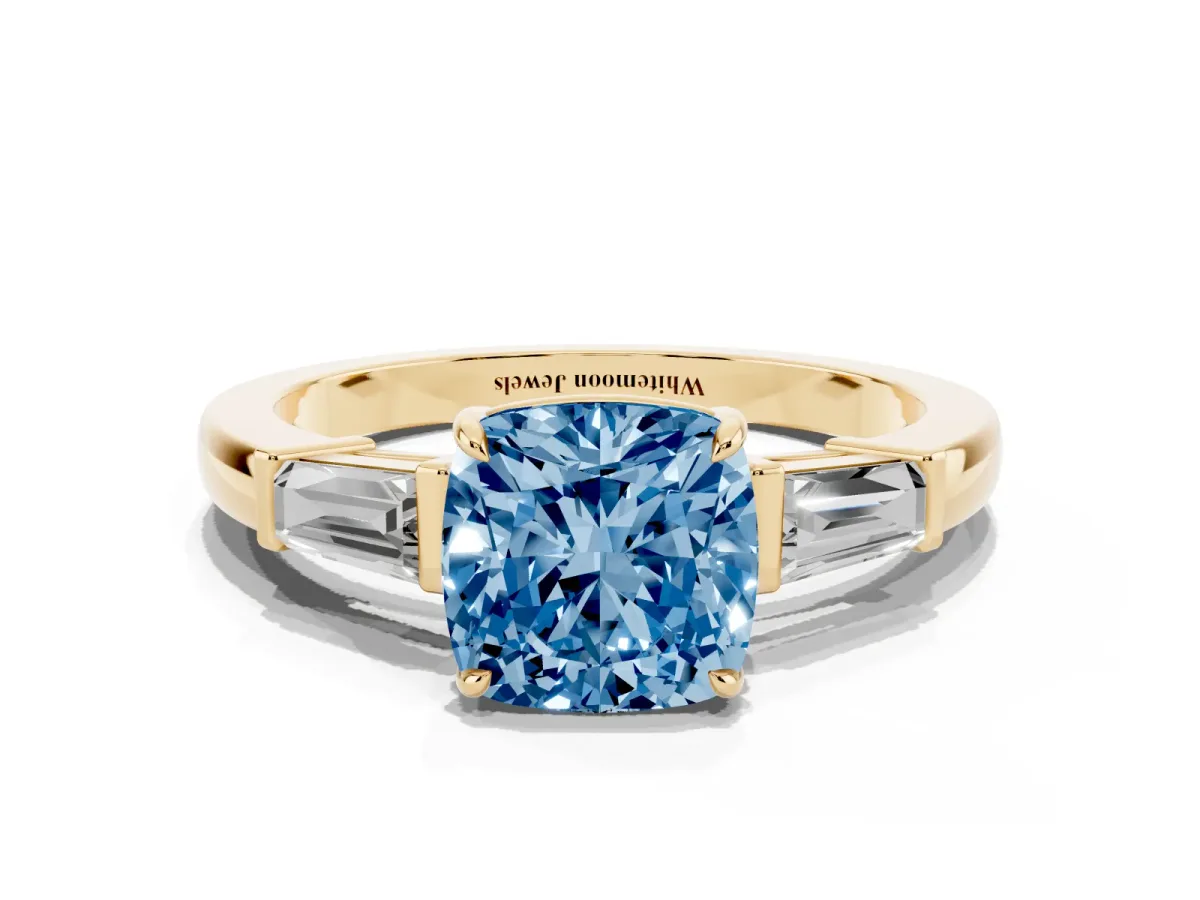 Fancy Blue Cushion Cut Diamond Three-Stone Ring with Tapered Baguette Side Stones and Prong Setting Yellow gold