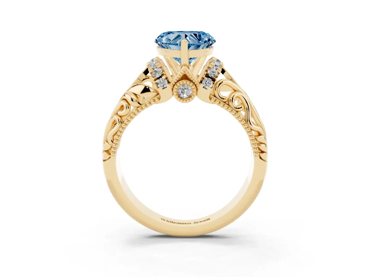 Fancy Blue Heart Cut Solitaire Filigree Engagement Ring with Halo and Prong Setting Yellow gold