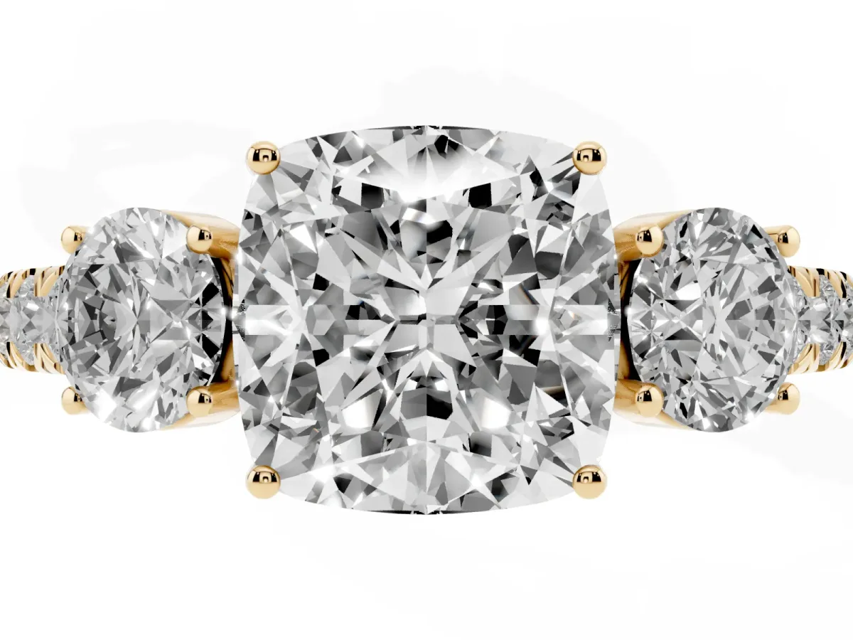 Cushion Cut Cut Diamond Three-Stone Ring with Round Side Stones and Pavé Band Yellow gold