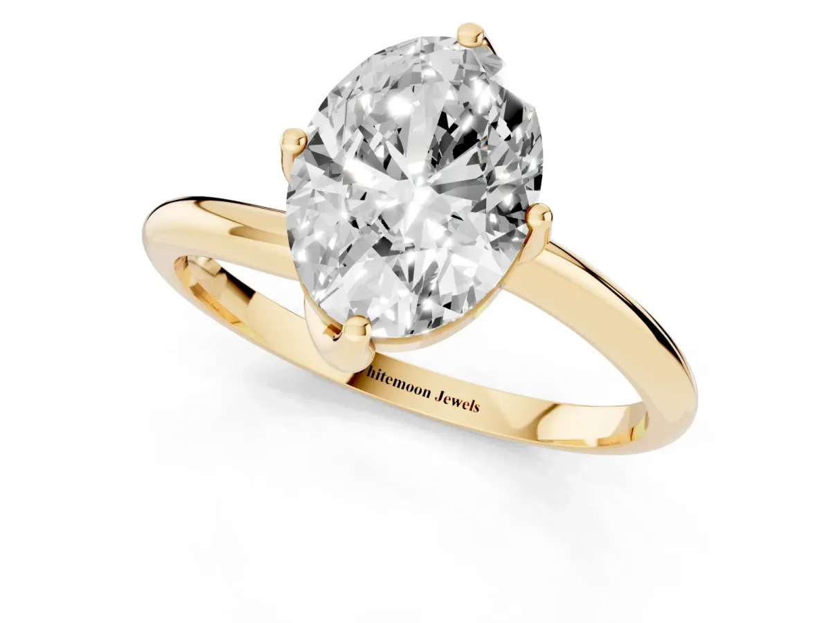 Oval Cut Diamond Solitaire Engagement Ring with Four-Prong Setting and Classic Band Yellow gold