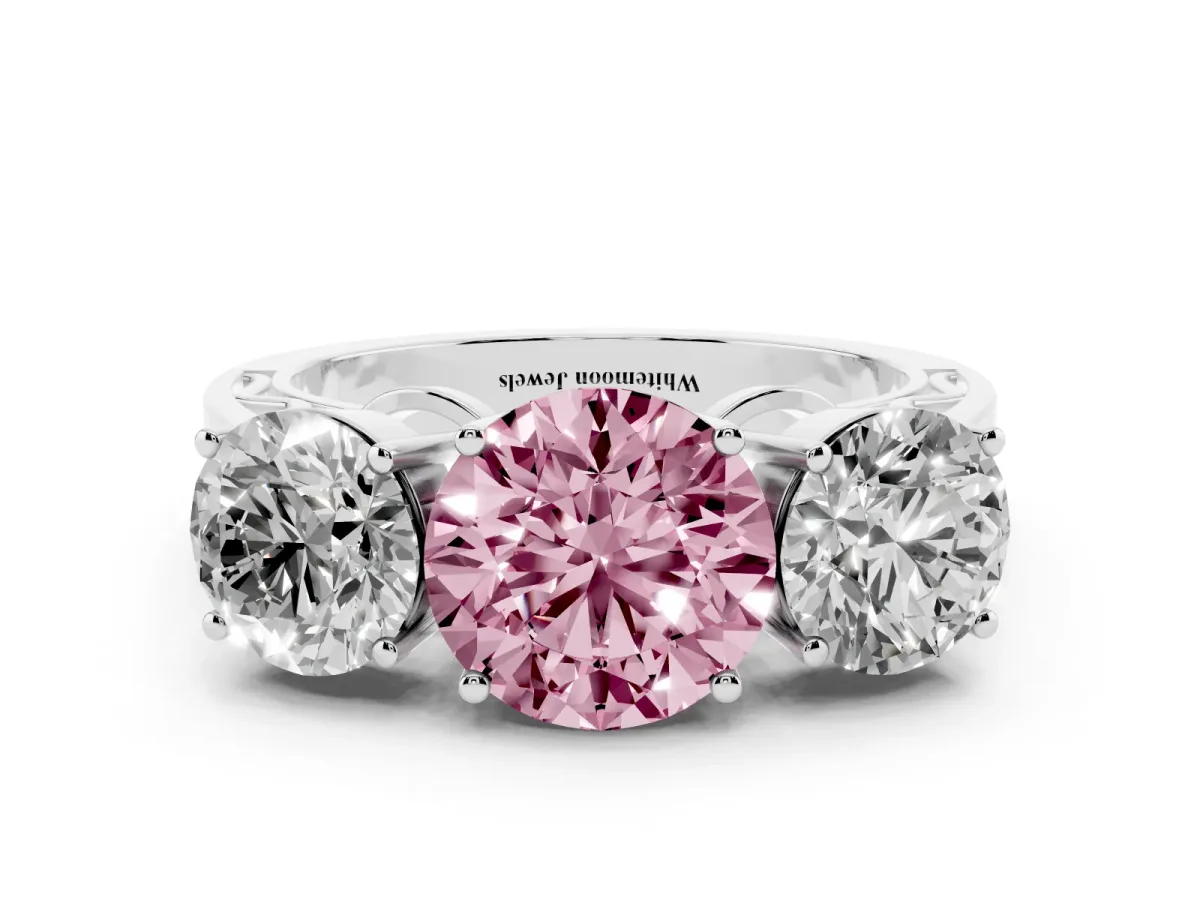 Fancy Pink Round Cut Diamond Three-Stone Ring with Prong Setting and Textured Band Platinum