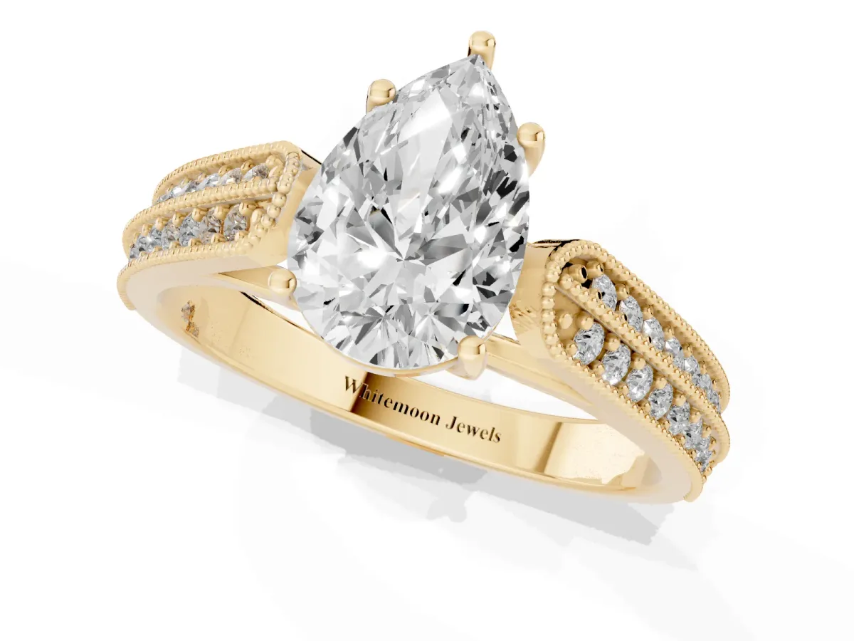 Pear Cut Cut Pave Split Shank Engagement Ring with Four-Prong Setting Yellow gold