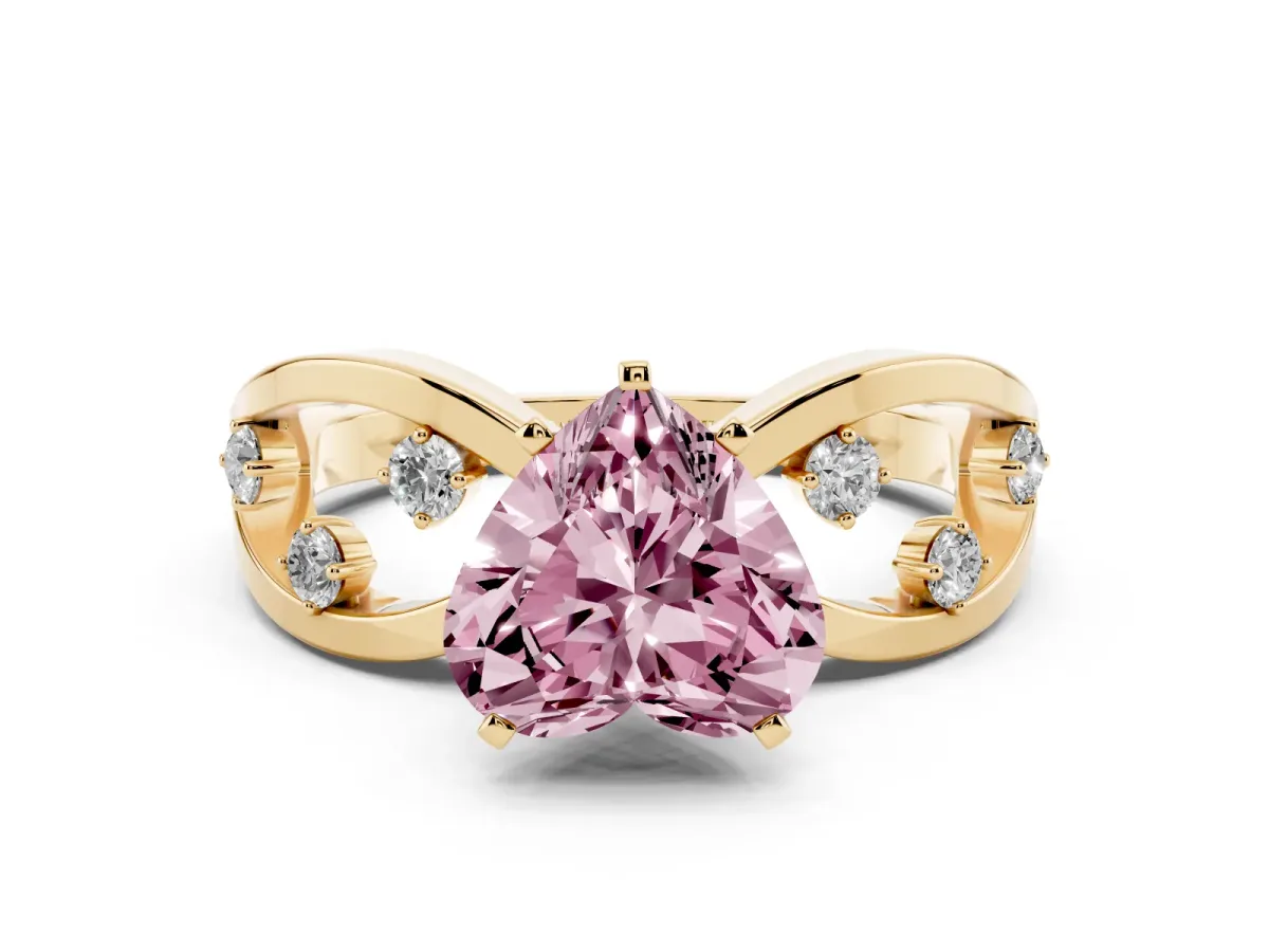 Fancy Pink Heart Cut Cut Solitaire Diamond with Side Stones on Criss-Cross Band and Four-Prong Setting Yellow gold