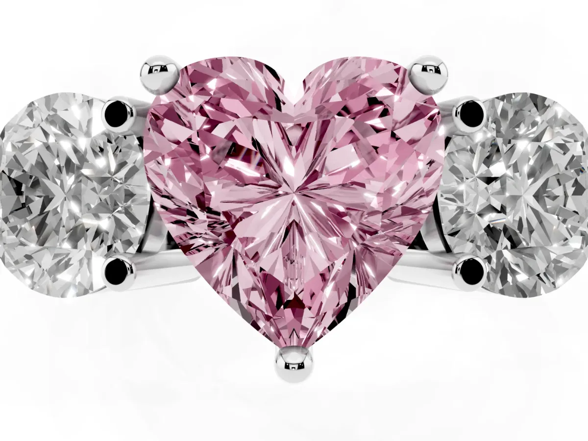 Fancy Pink Three-Stone Heart Cut Brilliant Cut Solitaire Ring with Prong Setting on a Classic Band White gold
