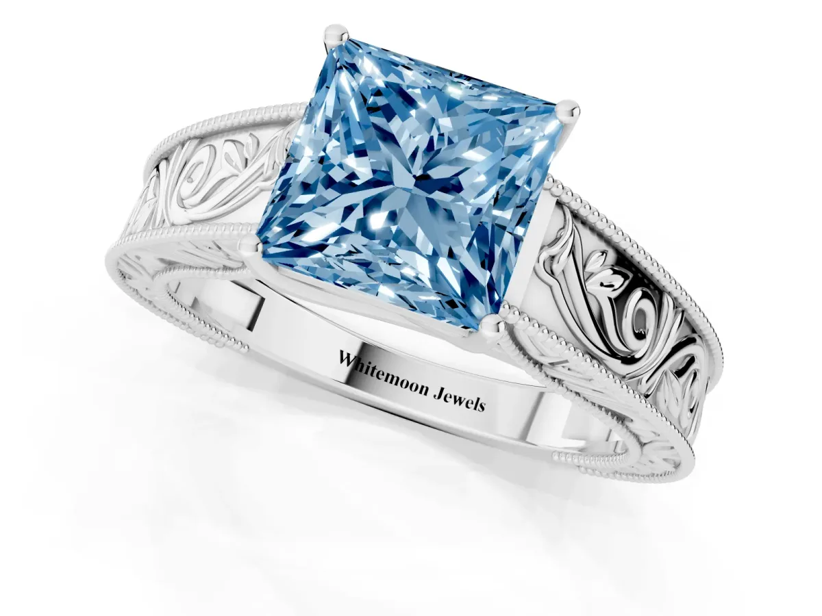 Fancy Blue Princess Cut Diamond Solitaire Ring with Engraved Band and Four-Prong Setting White gold