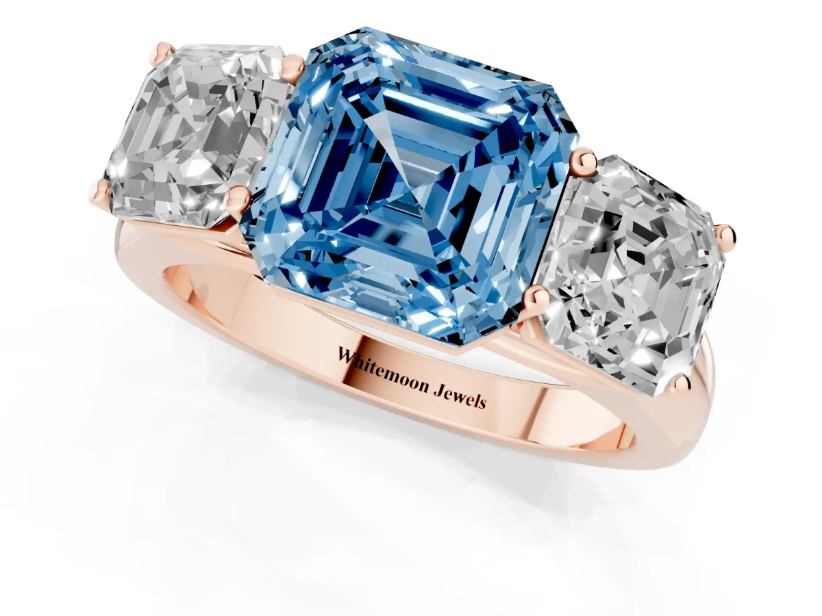 Fancy Blue Asscher Cut Three-Stone Diamond Ring with Prong Setting on a Classic Band Rose gold