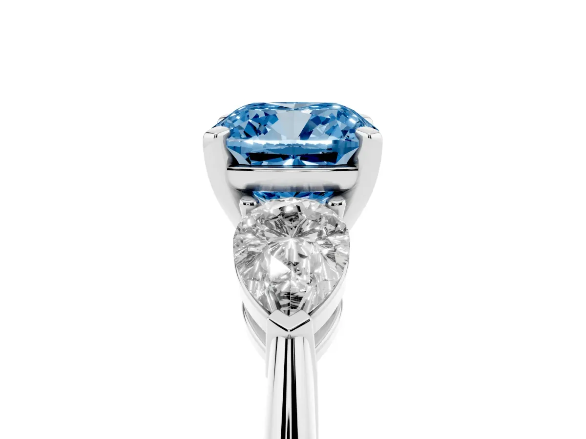 Fancy Blue Three-Stone Cushion Cut Diamond Ring with Pear Side Stones and Four-Prong Setting Platinum