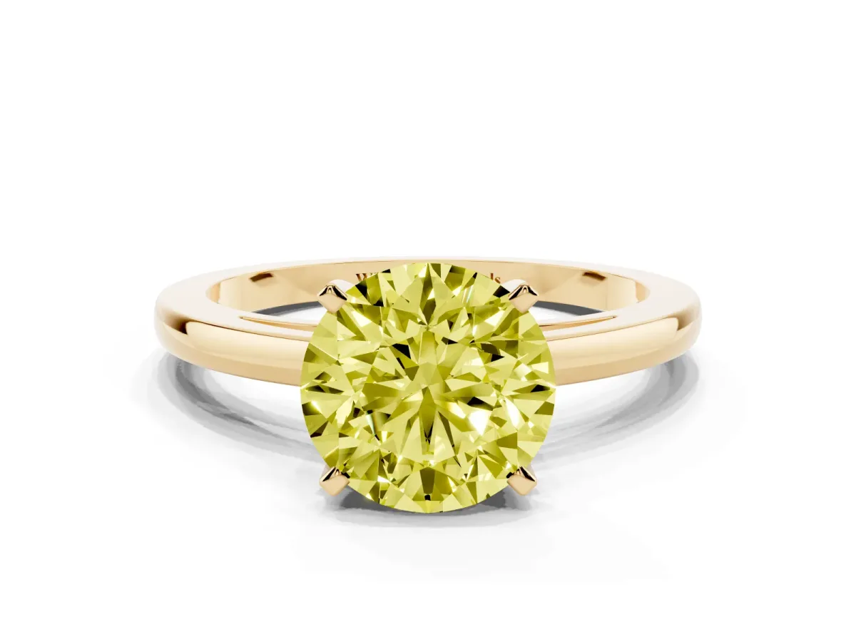 Fancy Yellow Round Cut Solitaire Diamond Engagement Ring with Four-Prong Setting on a Classic Band Yellow gold