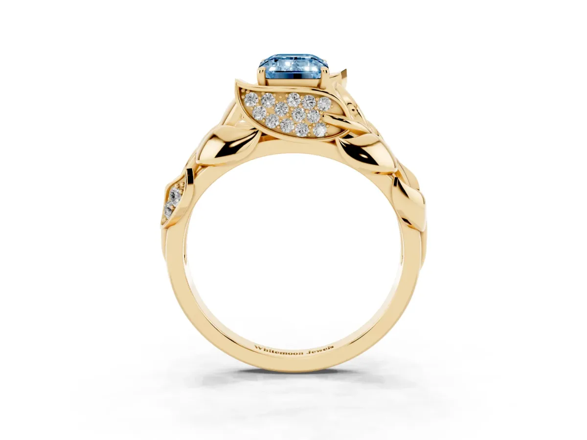 Fancy Blue Emerald Cut Diamond Leaf-Inspired Engagement Ring with Round Accents and Prong Setting Yellow gold