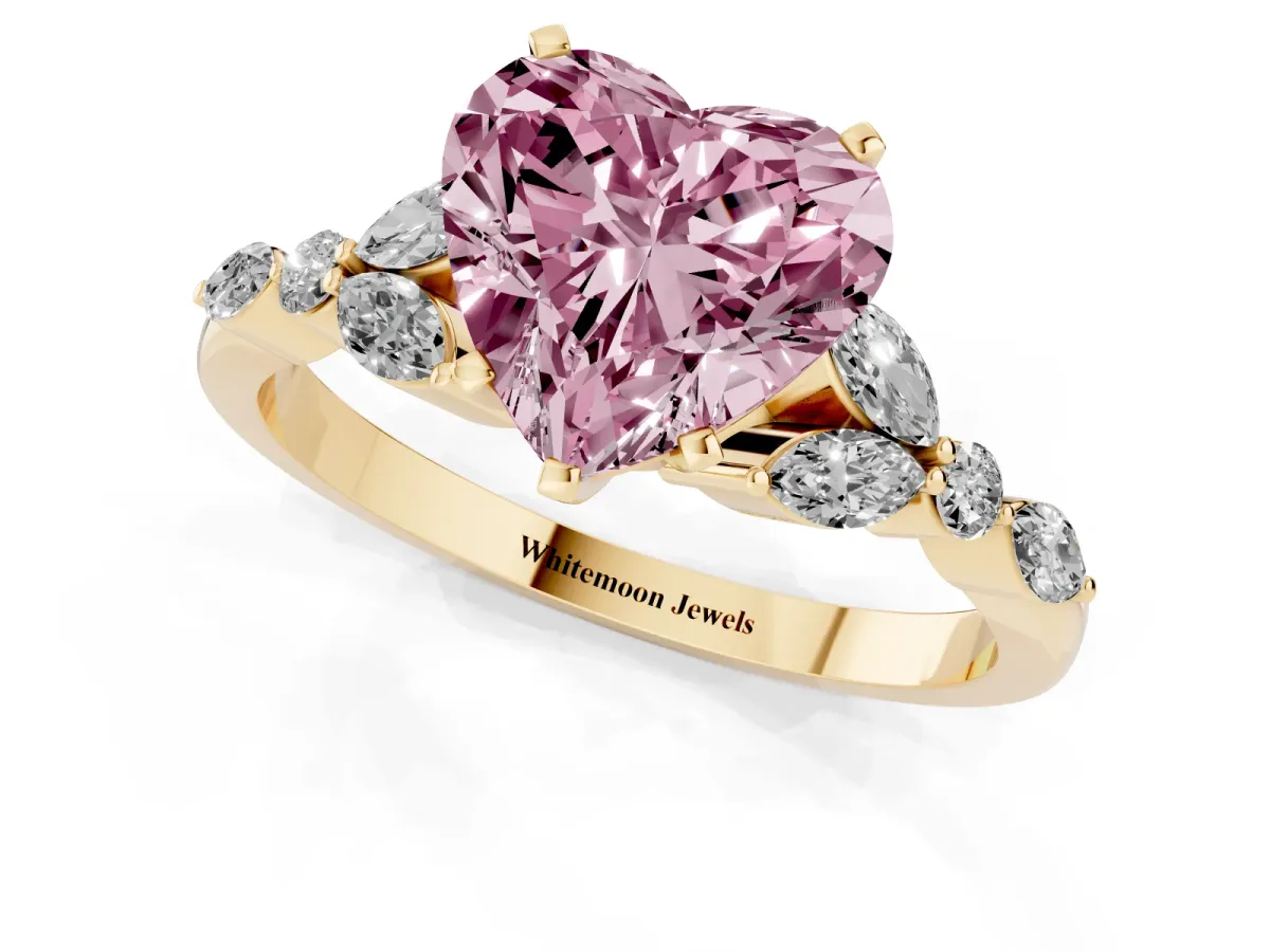 Fancy Pink Heart Cut Diamond Solitaire Ring with Side Stones and Four-Prong Setting Yellow gold