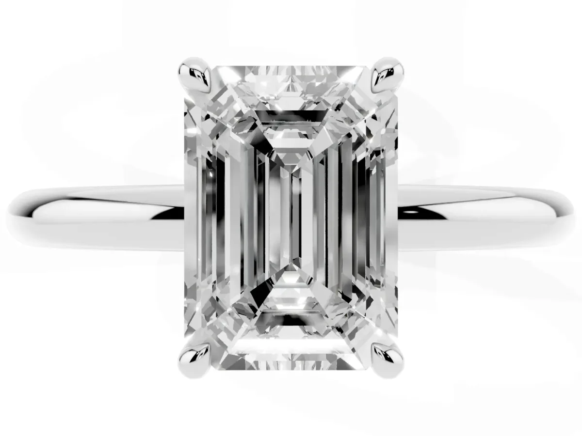 Emerald Cut Diamond Solitaire Ring with Thin Band and Four-Prong Setting White gold