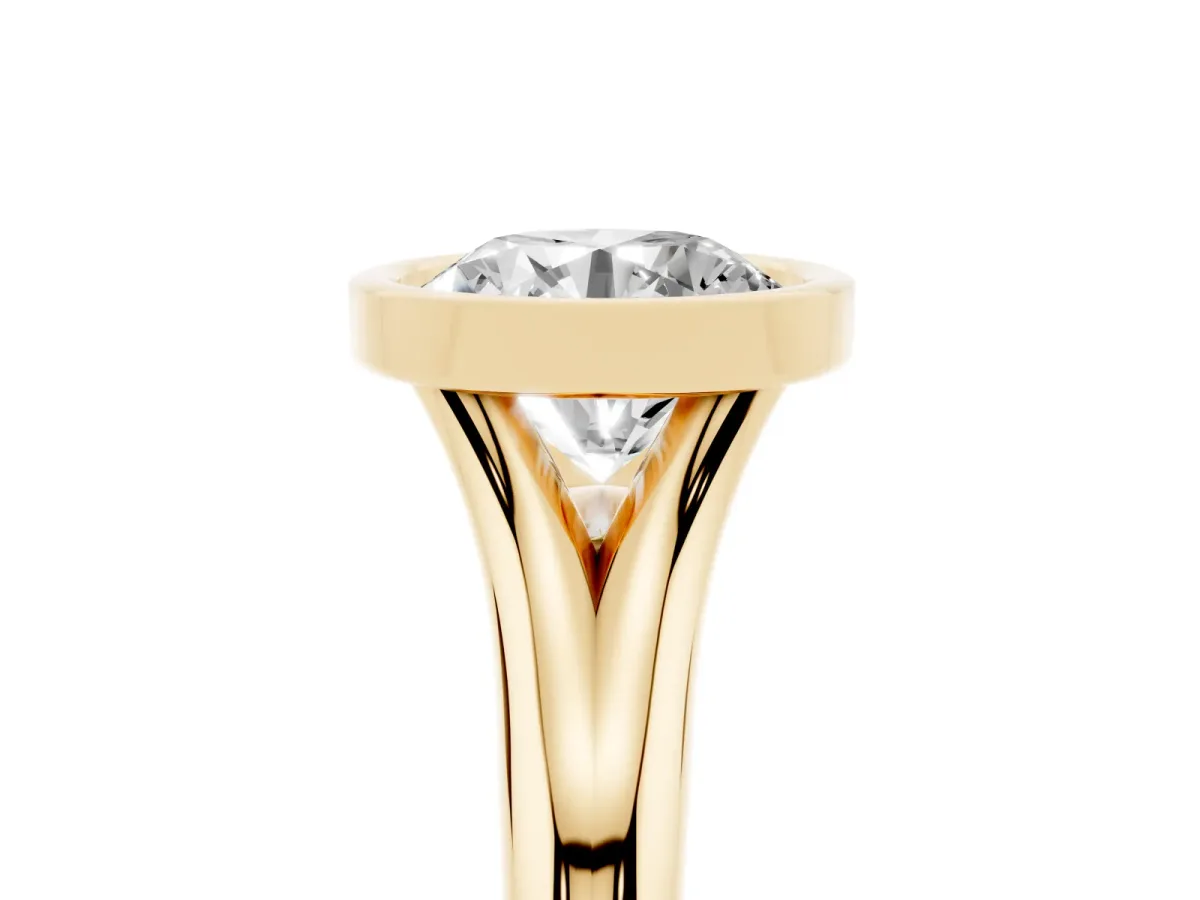 Bezel Set Round Cut Solitaire Diamond Ring with Smooth Band Yellow gold