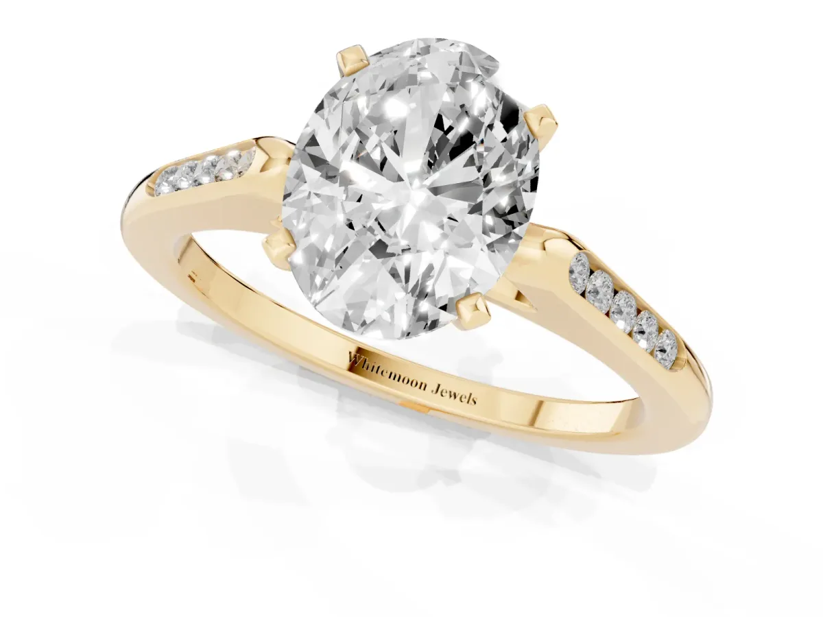Oval Cut Diamond Solitaire Ring with Channel Set Round Band and Prong Setting Yellow gold