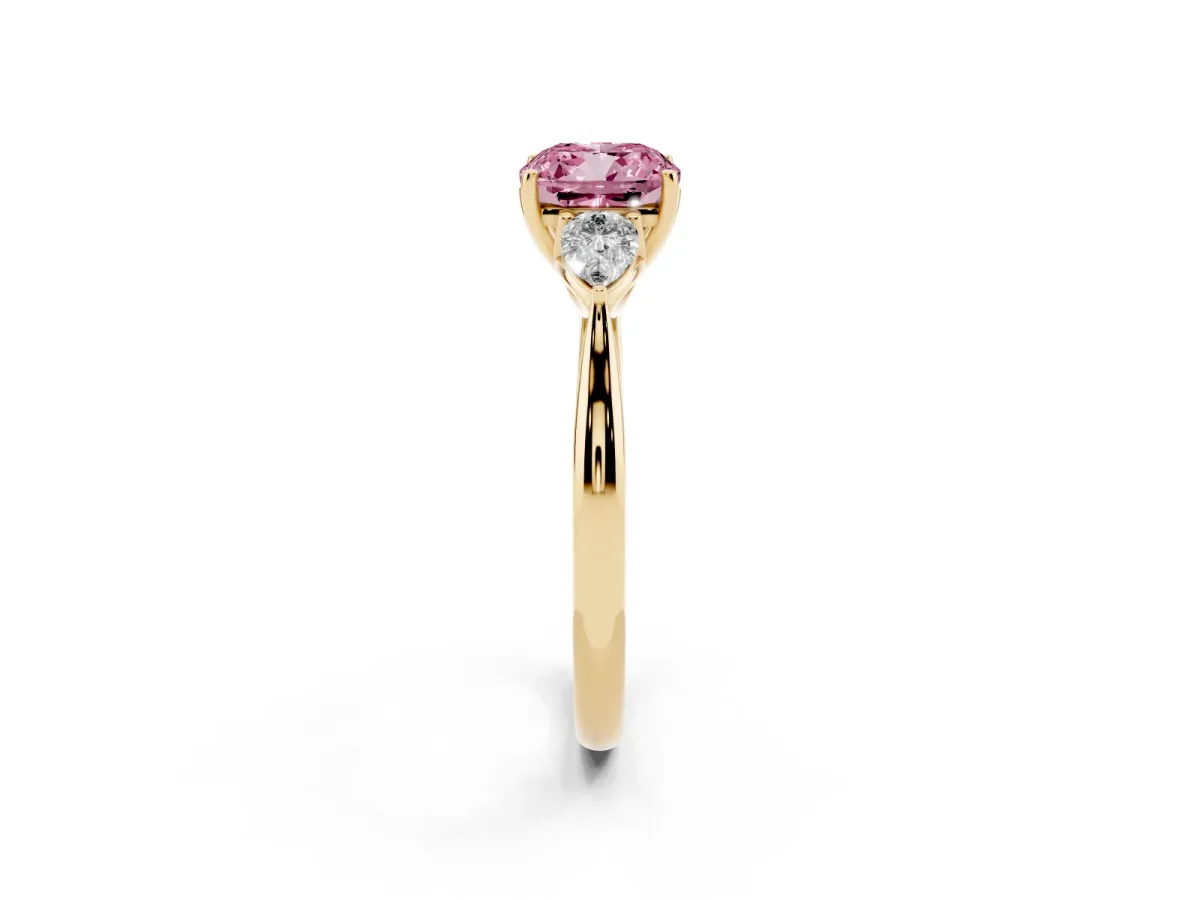 Fancy Pink Three-Stone Cushion Cut Brilliant Diamond Solitaire Ring with Tapered Band and Four-Prong Setting Yellow gold