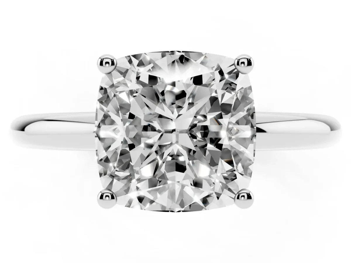 Cushion Cut Cut Solitaire Engagement Ring with Four-Prong Setting and Classic Band Silver