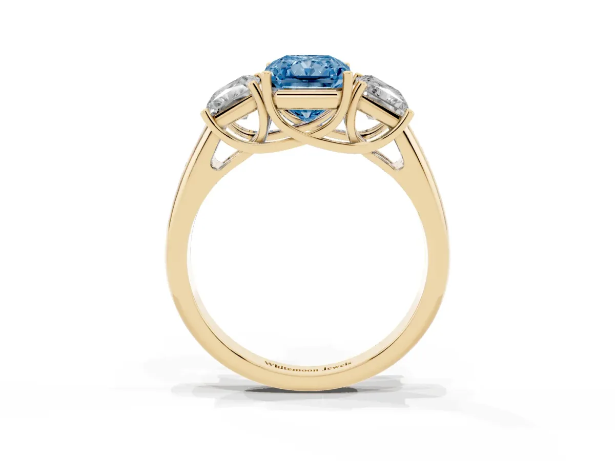 Fancy Blue Three-Stone Radiant Cut Diamond Engagement Ring with Prong Setting Yellow gold