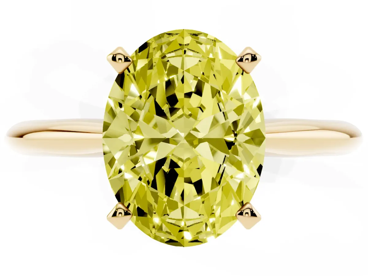 Fancy Yellow Oval Cut Cut Solitaire Ring with Four-Prong Setting on a Classic Band Yellow gold