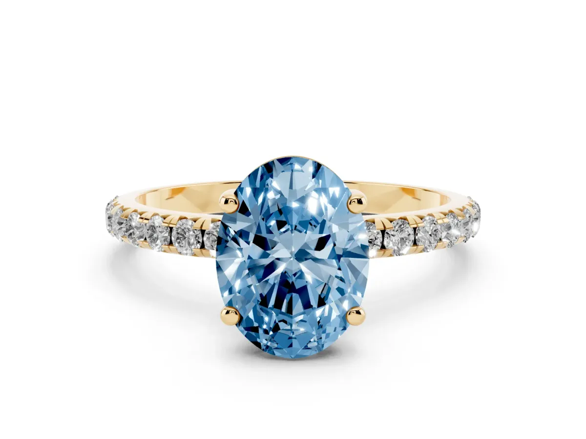 Fancy Blue Oval Cut Cut Diamond Solitaire Ring with Micro Pave Band and Four Prong Setting Yellow gold