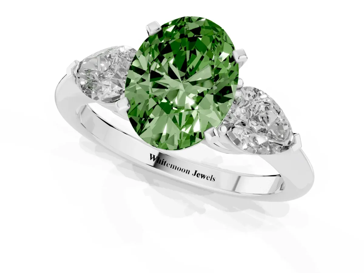 Fancy Green Three-Stone Oval Cut Diamond Ring with Pear Side Stones and Four-Prong Setting Silver