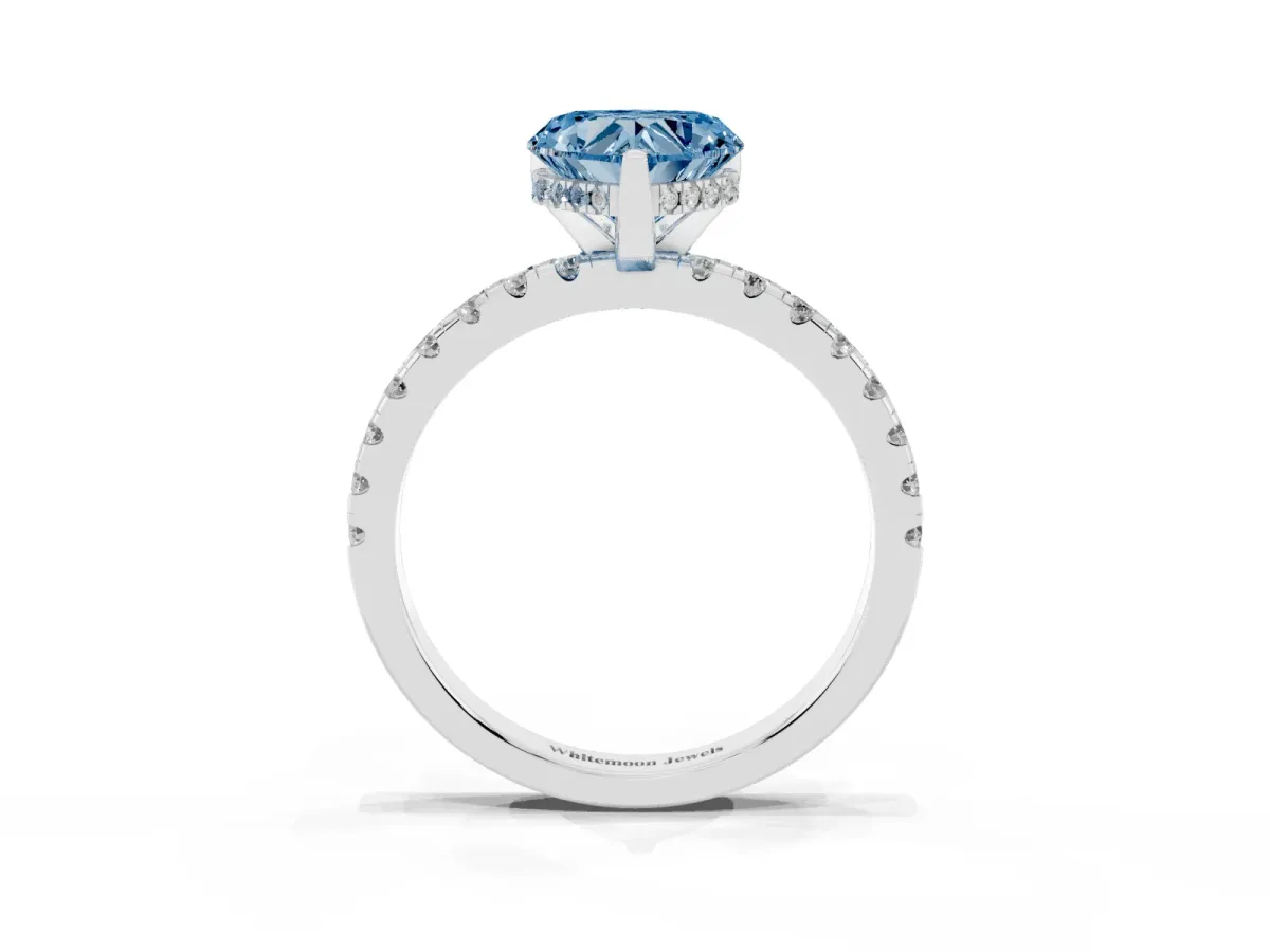 Fancy Blue Heart Cut Diamond Solitaire Ring with Round Pavé Band and Four-Prong Setting Silver
