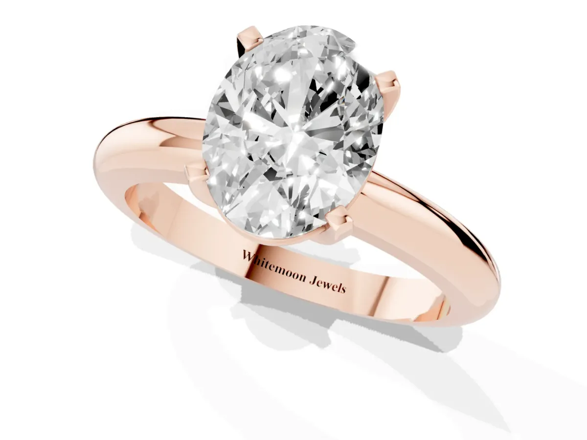 Oval Cut Diamond Solitaire Engagement Ring with Round Band and Four-Prong Setting Rose gold
