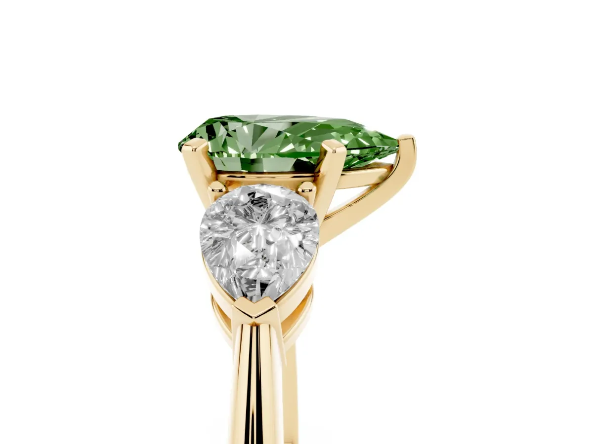 Fancy Green Three-Stone Pear Cut Diamond Ring with Pear Side Stones and Four-Prong Setting Yellow gold