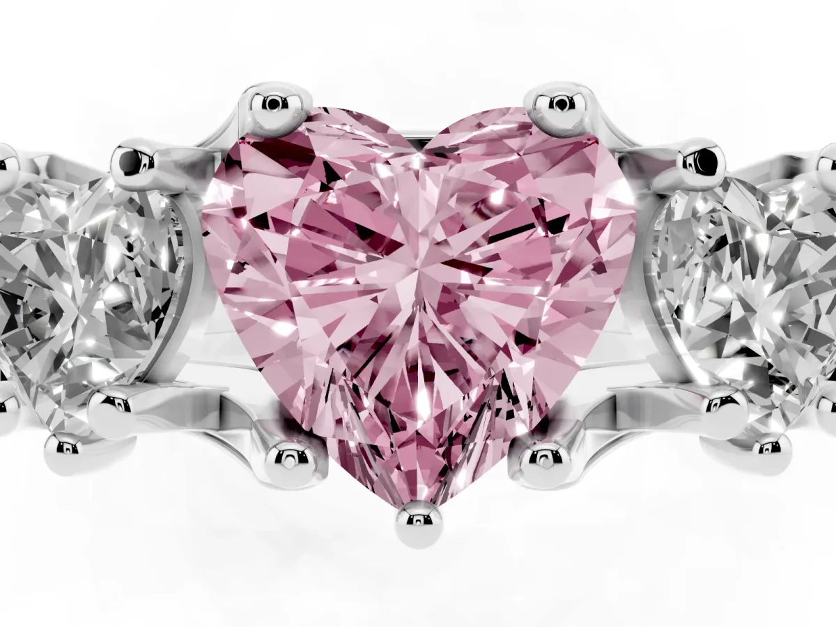 Fancy Pink Heart Cut Diamond Three-Stone Ring with Channel Set Band and Four-Prong Setting Silver