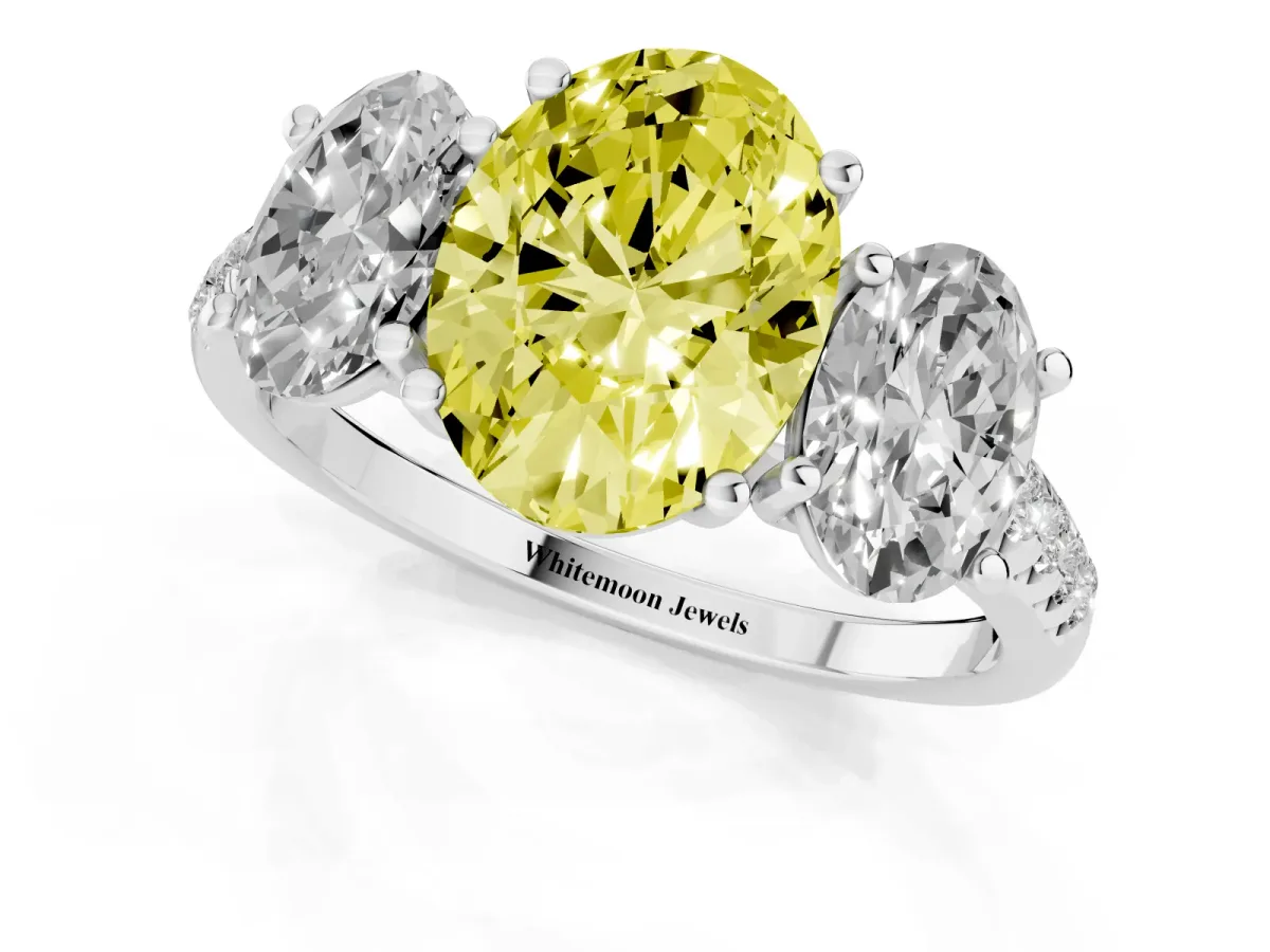 Fancy Yellow Three-Stone Oval Cut Diamond Ring with Round Pavé Band and Prong Setting Silver