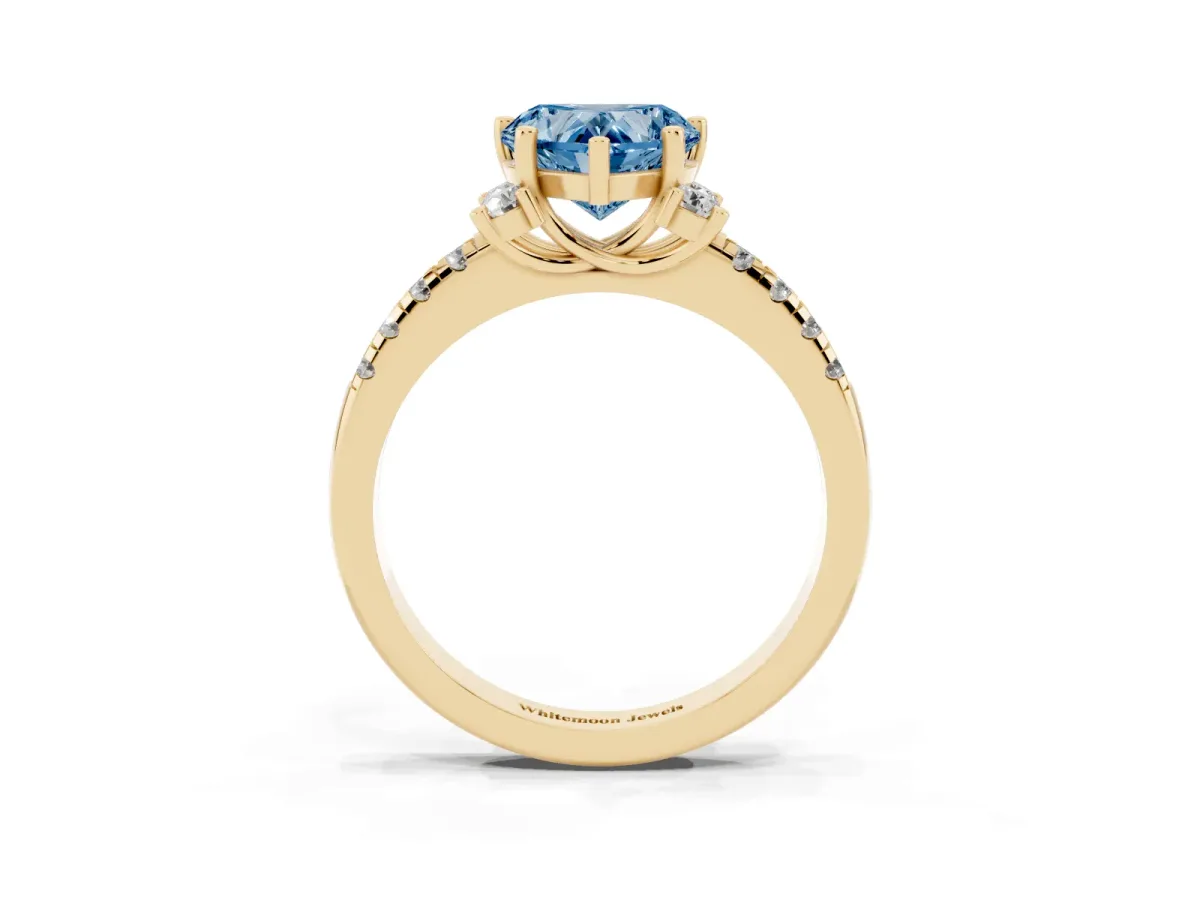 Fancy Blue Heart Cut Diamond Three-Stone Pave Band with Four-Prong Setting Yellow gold