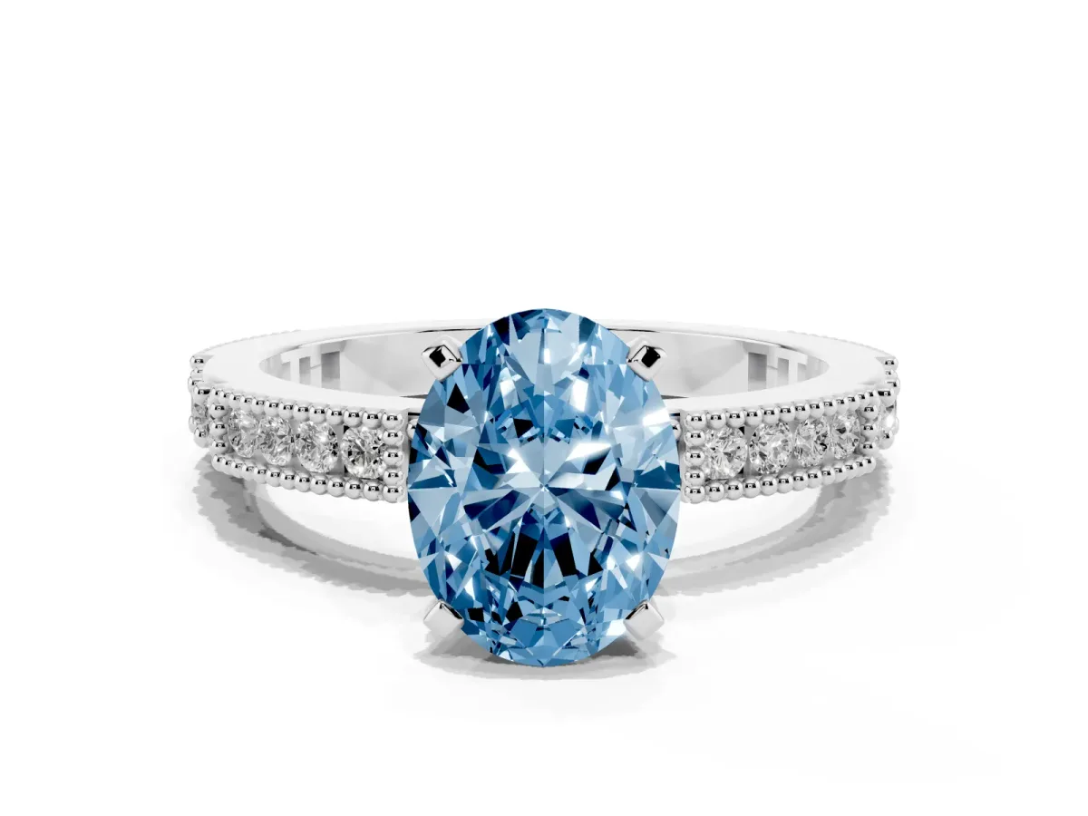 Fancy Blue Oval Cut Solitaire with Pavé Band and Four-Prong Setting Silver