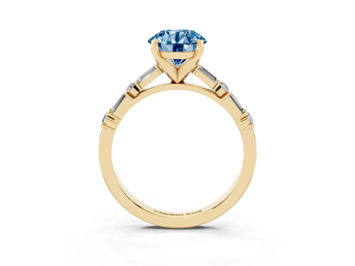 Fancy Blue Round Cut Diamond Solitaire with Side Baguettes and Channel Set Band Yellow gold