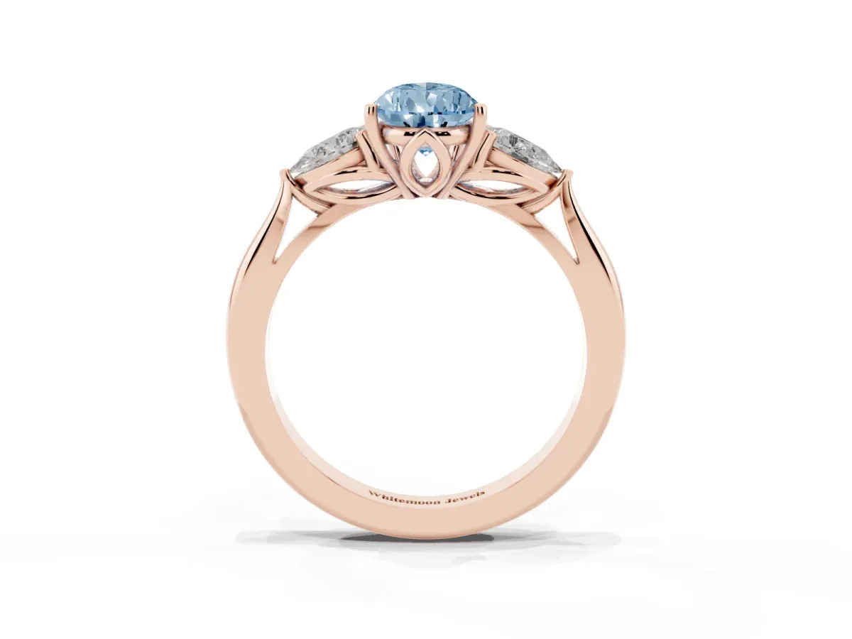 Fancy Blue Three-Stone Pear Cut Brilliant Diamond Solitaire Ring with Tapered Band and Four-Prong Setting Rose gold