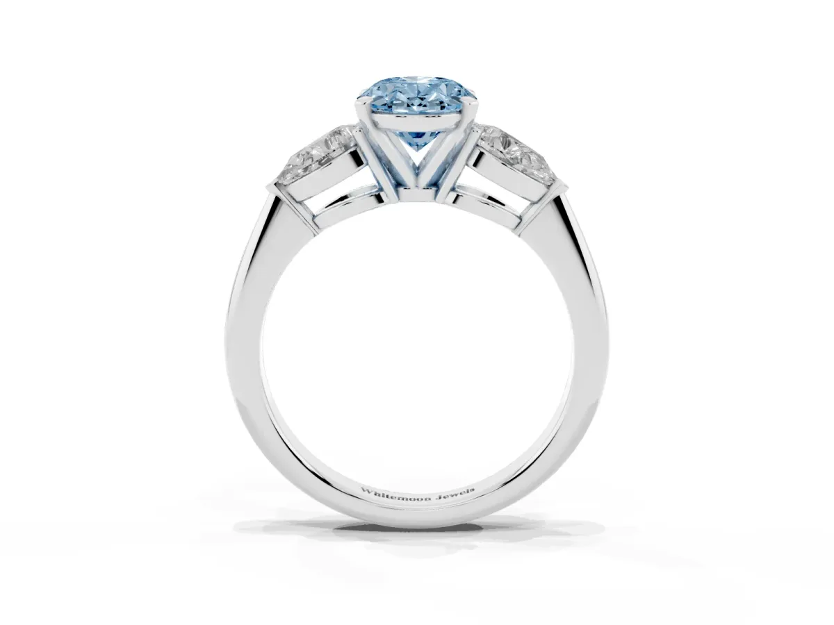 Fancy Blue Three-Stone Oval Cut Diamond Ring with Pear Side Stones and Four-Prong Setting Platinum