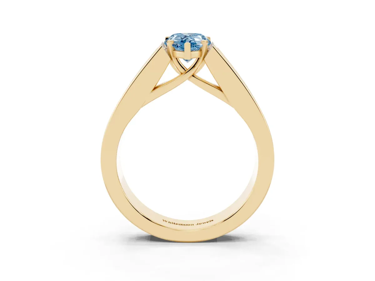 Fancy Blue Pear Cut Cut Channel Set Solitaire Ring with Four-Prong Setting Yellow gold