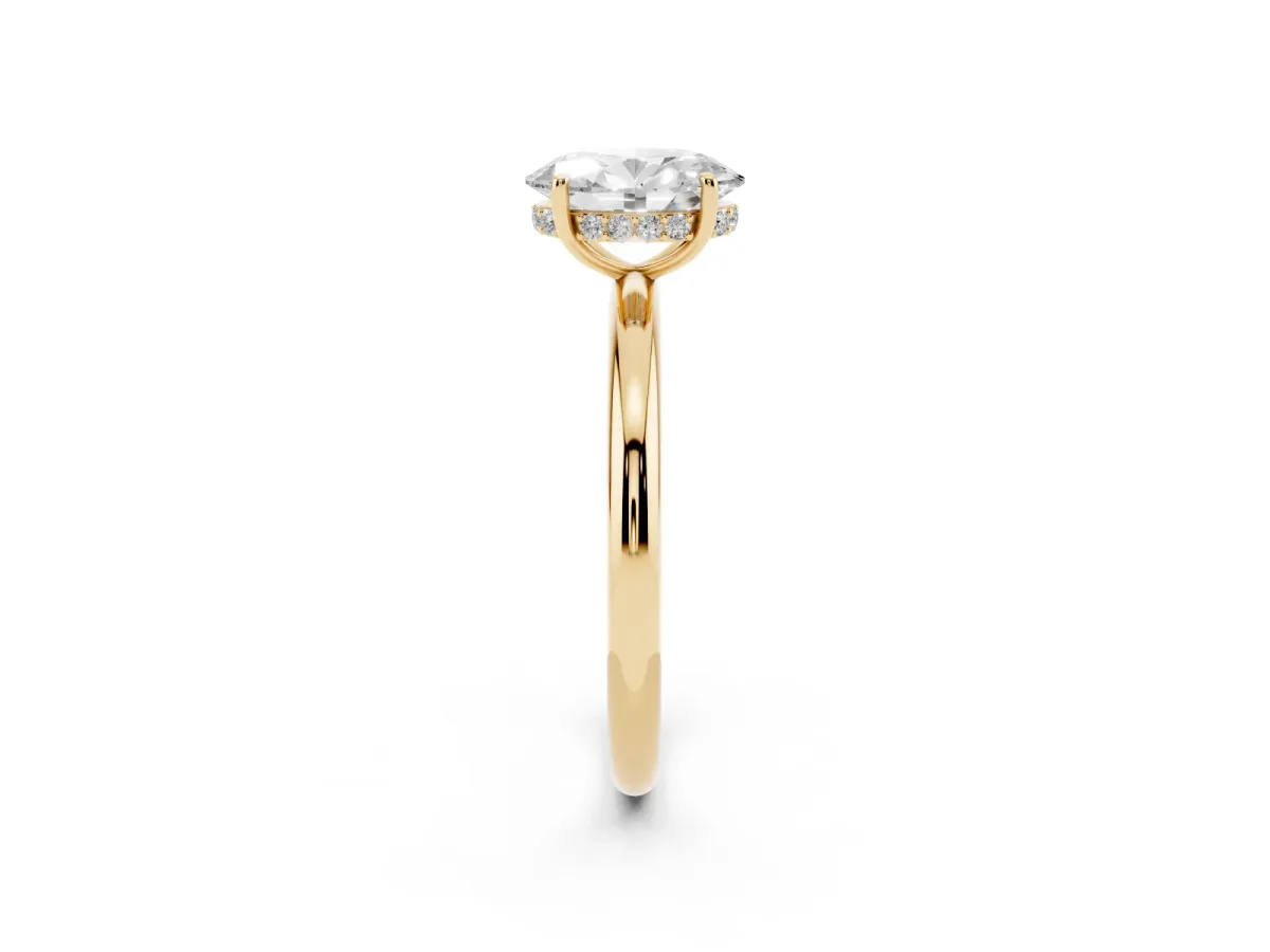 Oval Cut Diamond Solitaire Ring with Thin Band and Four-Prong Setting Yellow gold