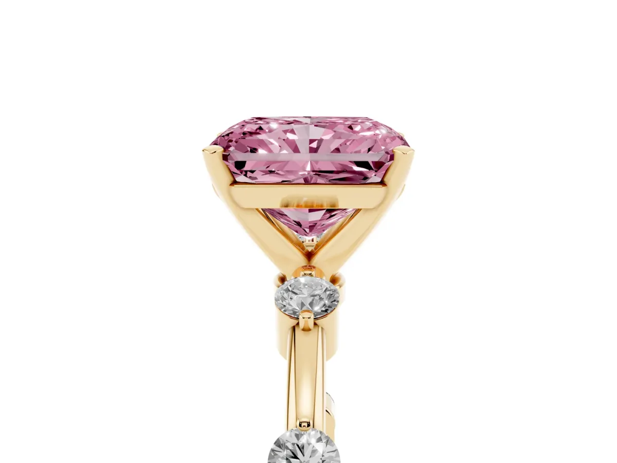 Fancy Pink Radiant Cut Solitaire Diamond Ring with Bezel Set Side Stones and Prong Setting Yellow gold