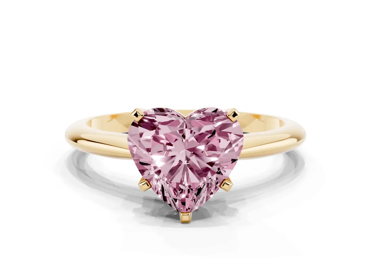 Fancy Pink Heart Cut Cut Solitaire Ring with Four-Prong Setting on a Classic Band Yellow gold