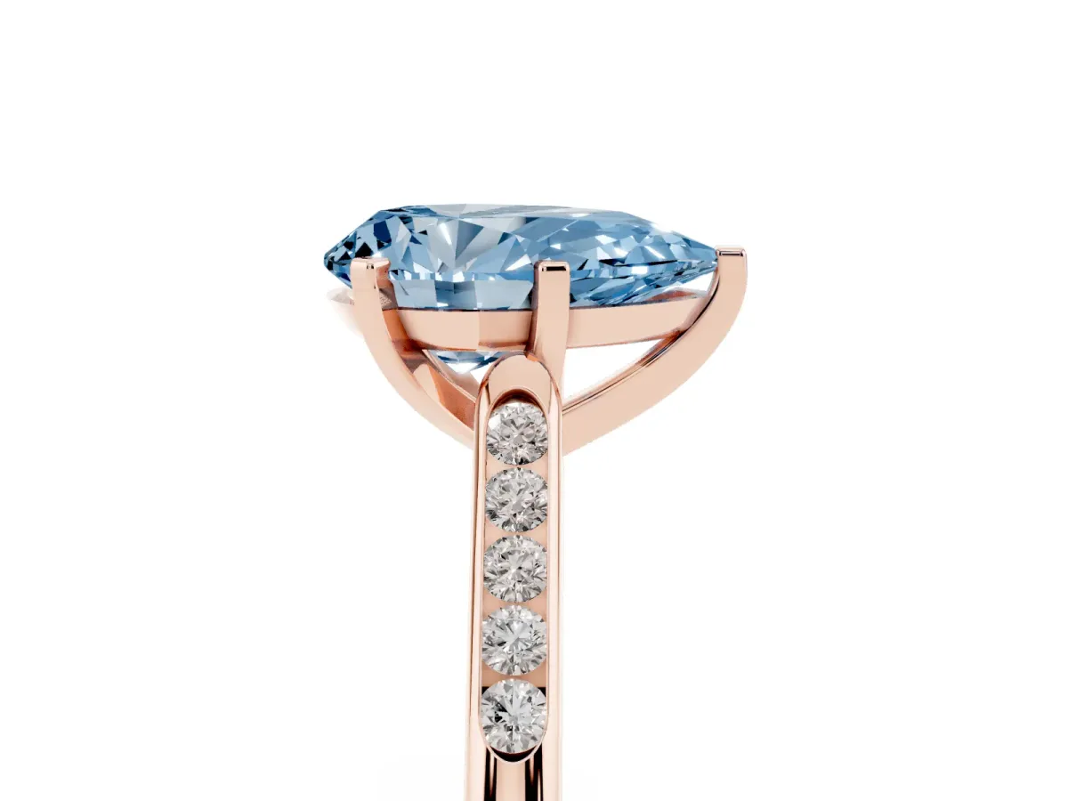 Fancy Blue Pear Cut Diamond Solitaire Ring with Channel Set Round Band and Prong Setting Rose gold