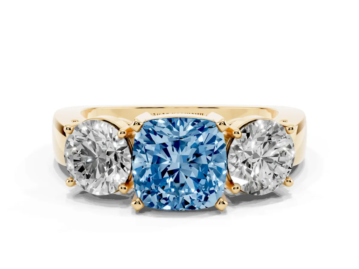 Fancy Blue Three-Stone Cushion Cut Diamond Ring with Round Side Stones, Classic Band, and Four-Prong Setting Yellow gold