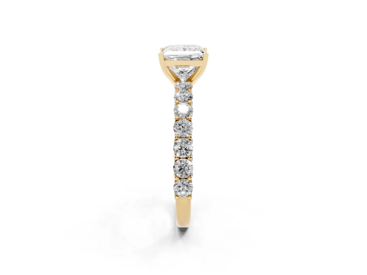 Princess Cut Diamond Solitaire Ring with Shared Prong Pavé Band and Four-Prong Setting Yellow gold