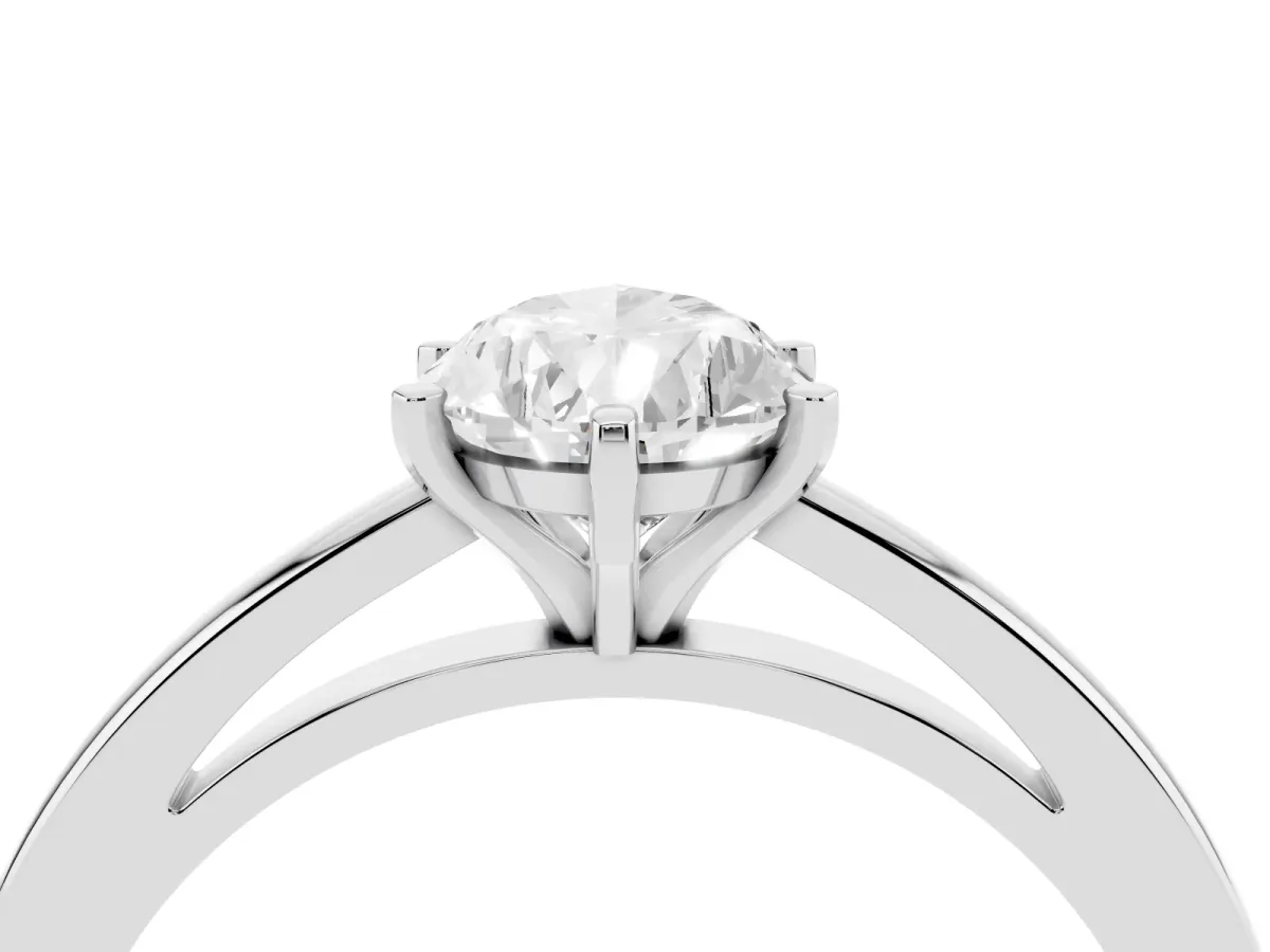 Pear Cut Solitaire Diamond Engagement Ring with Four-Prong Setting on a Classic Band White gold