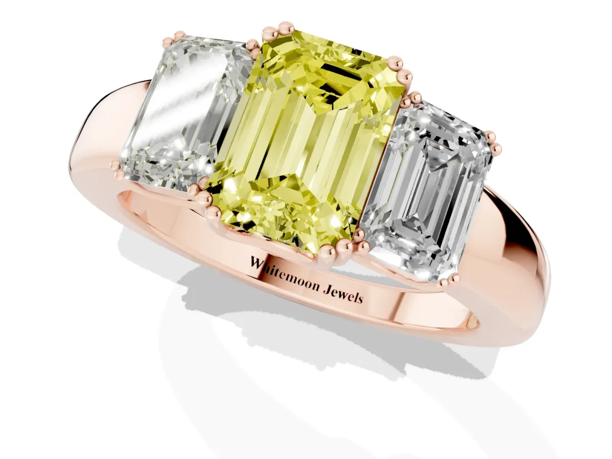 Fancy Yellow Three-Stone Emerald Cut Cut Diamond Ring with Channel Set Band and Four-Prong Setting Rose gold