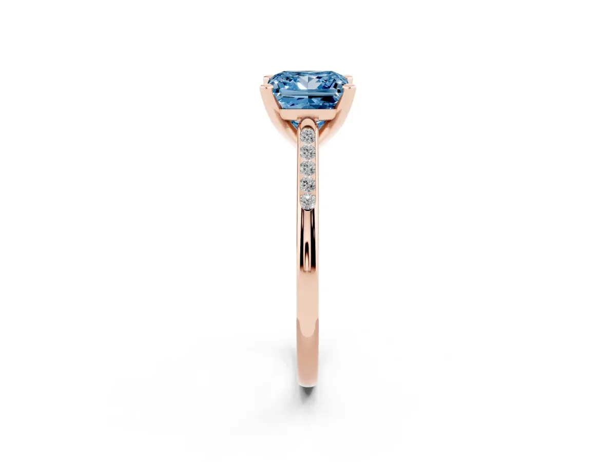 Fancy Blue Princess Cut Diamond Solitaire Ring with Channel Set Round Band and Prong Setting Rose gold