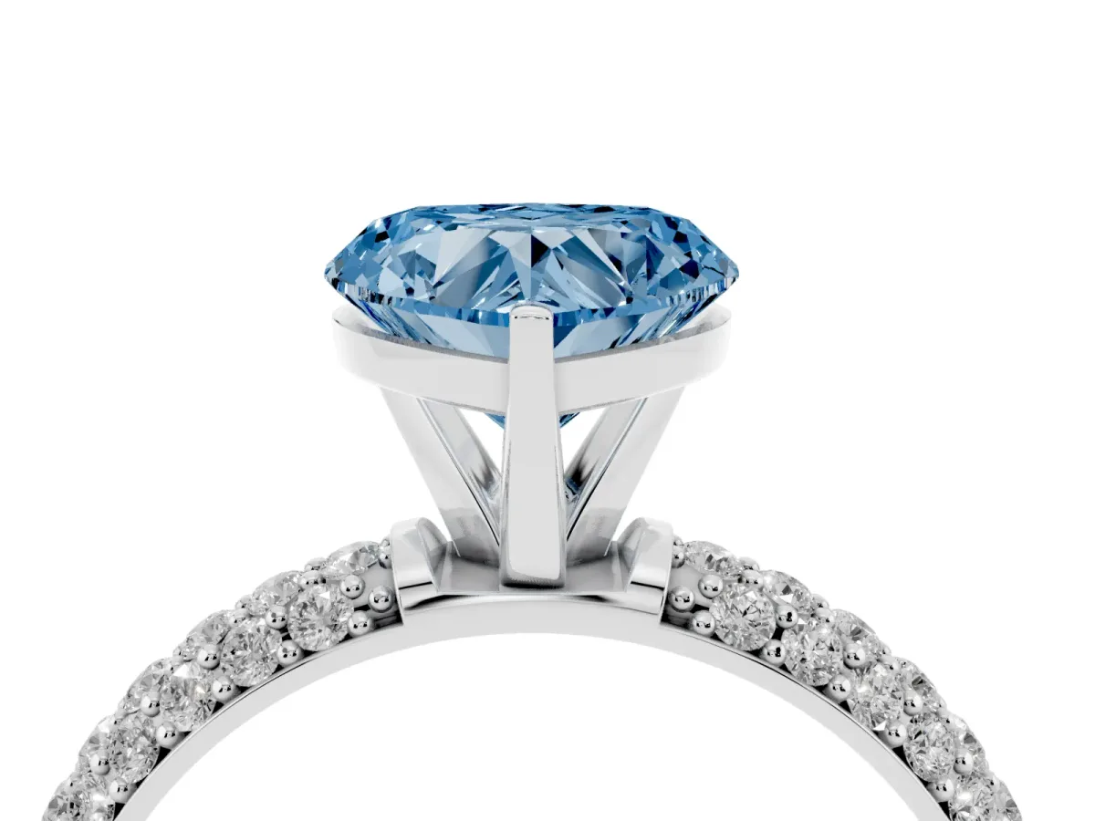 Fancy Blue Heart Cut Diamond Solitaire Ring with Prong Setting and Pavé Band Silver