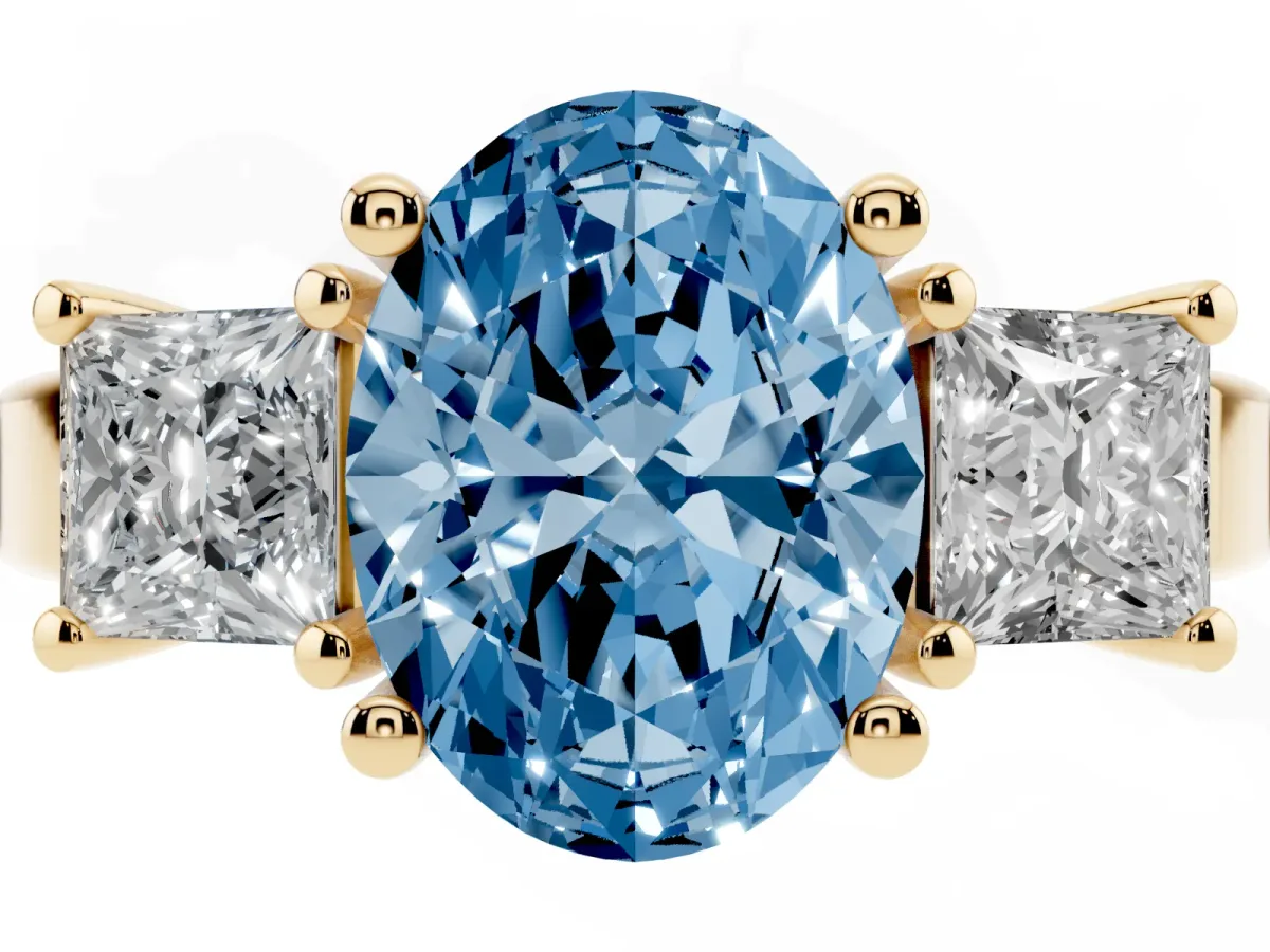 Fancy Blue Three-Stone Oval Cut Cut Solitaire Ring with Prong Setting Yellow gold