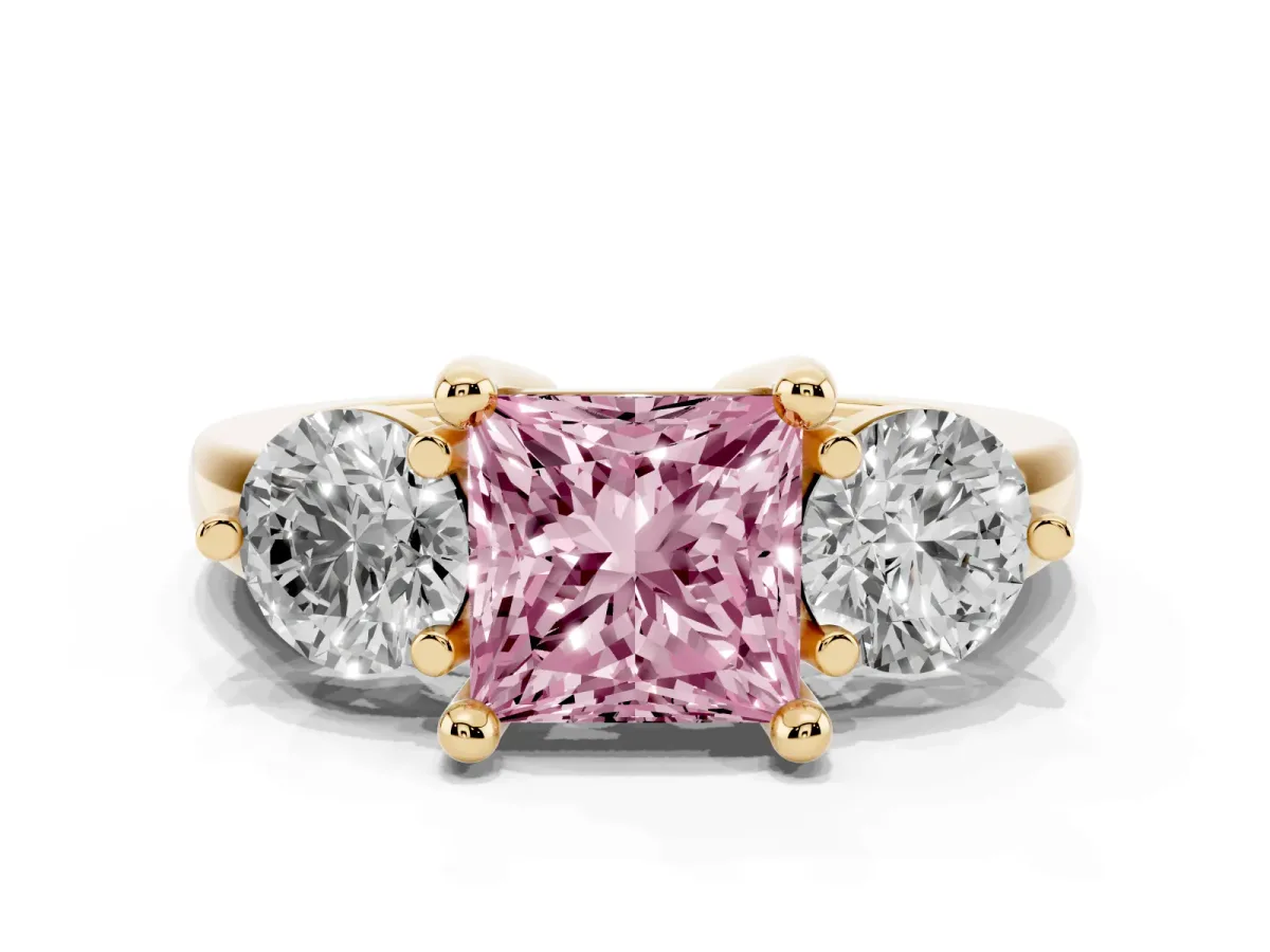 Fancy Pink Three-Stone Princess Cut Brilliant Cut Solitaire Ring with Prong Setting on a Classic Band Yellow gold